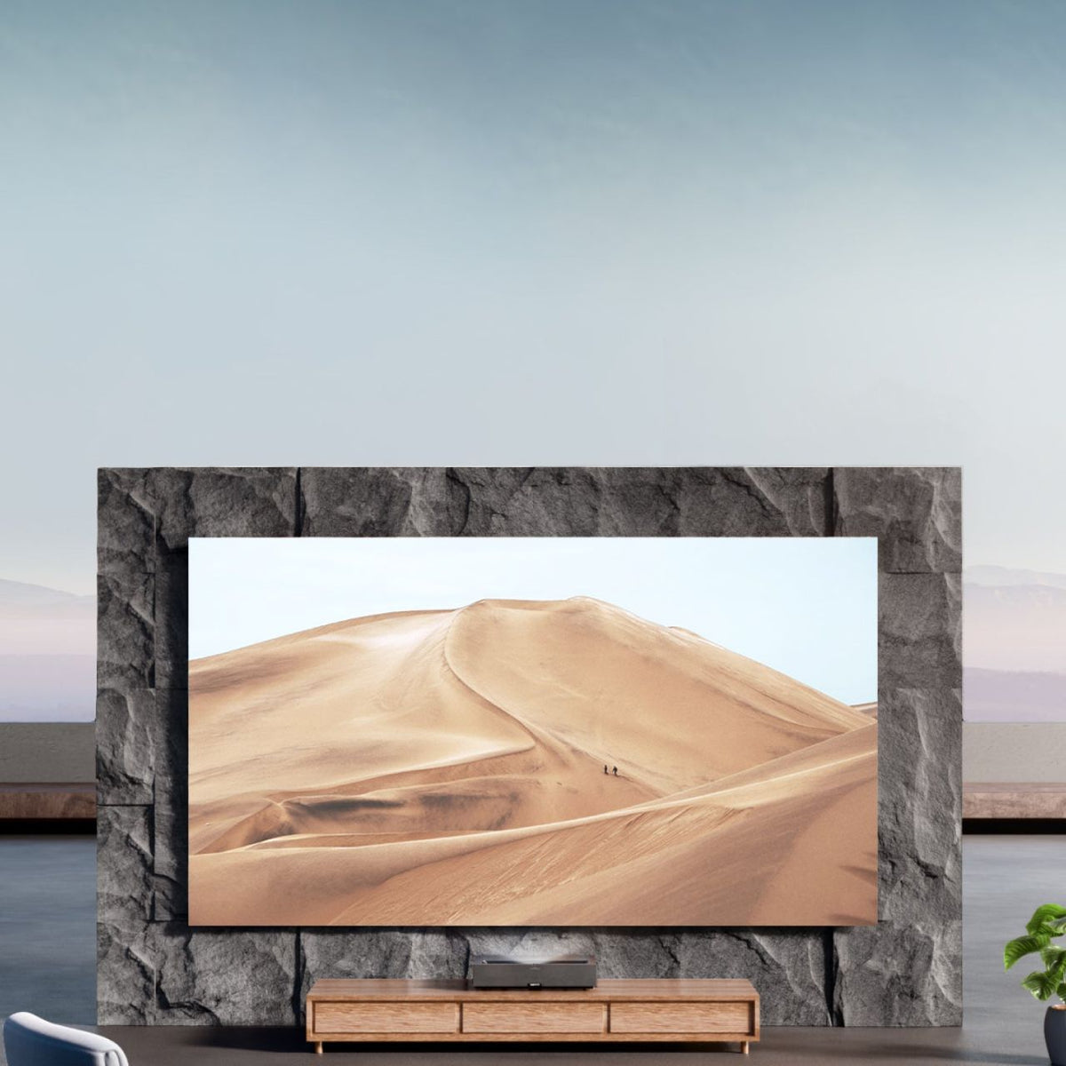 Formovie Theater Premium & celexon BrightOnyx UST-Bundle – Formovie Theater Premium auf dem Lowboard unter einer großen Projektionsfläche